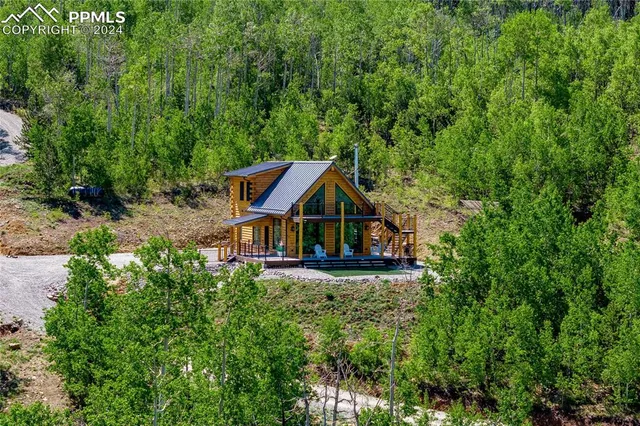 a view of a house with a yard porch and sitting area