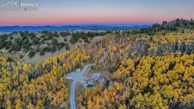 a view of a balcony with wooden floor and windows
