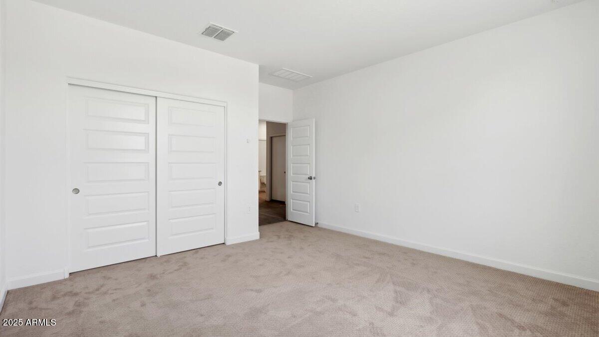 2082 West Starfire Avenue Apache Junction, AZ 85120 - Photo 15 of 35 an empty room with closet area