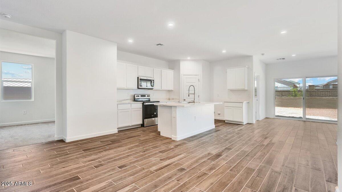 2082 West Starfire Avenue Apache Junction, AZ 85120 - Photo 6 of 35 a view of kitchen with wooden floor