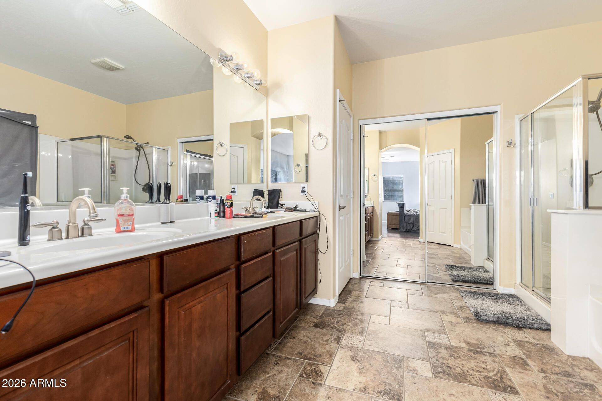 24541 Plum Road Florence, AZ 85132 - Photo 20 of 47 a bathroom with a double vanity sink mirror and shower