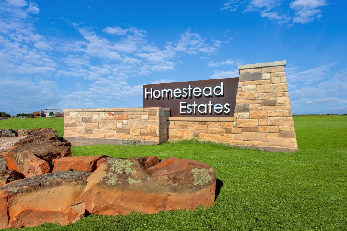 18420 Stellers Sea Street Elgin, TX 78621 - Photo 6 of 7 a view of a street with benches in the background