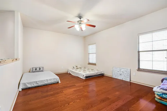 a bedroom with bed and window