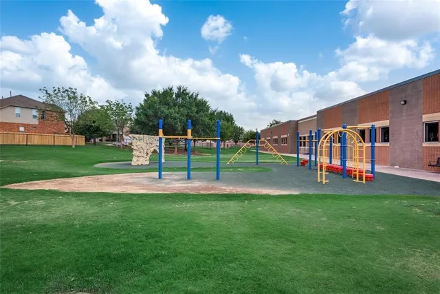 a view of a park with swings and slides
