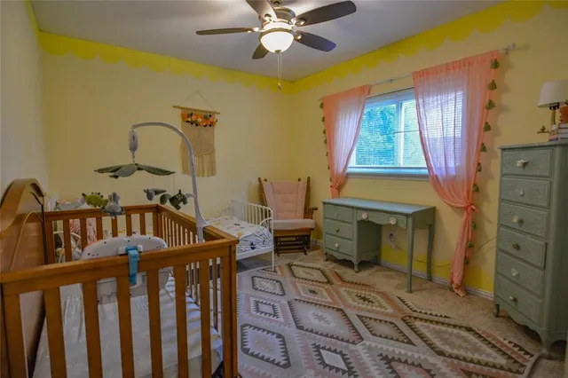 a bedroom with furniture and a window