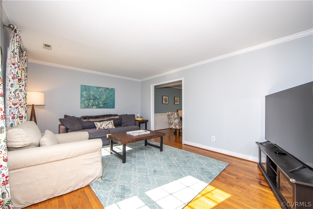 6212 Lansgate Road Midlothian, VA 23112 - Photo 11 of 26 a living room with furniture and a flat screen tv