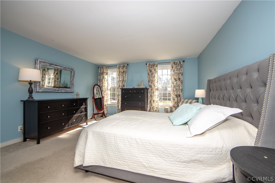 6212 Lansgate Road Midlothian, VA 23112 - Photo 14 of 26 a bedroom with a bed and a dresser