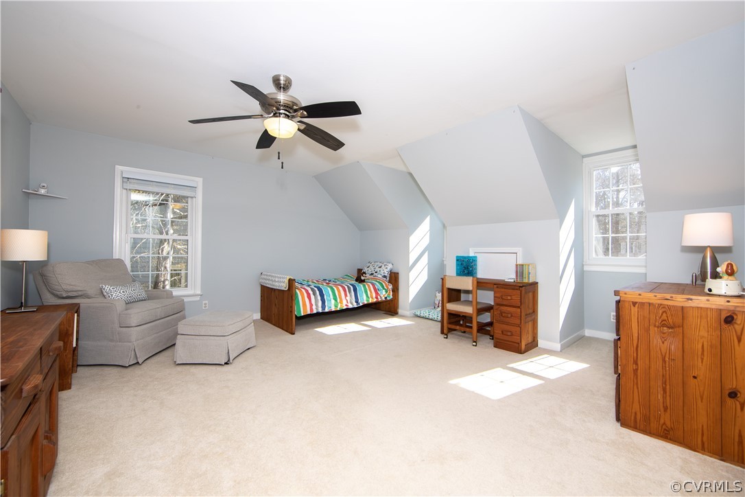 6212 Lansgate Road Midlothian, VA 23112 - Photo 20 of 26 a living room with furniture and a chandelier