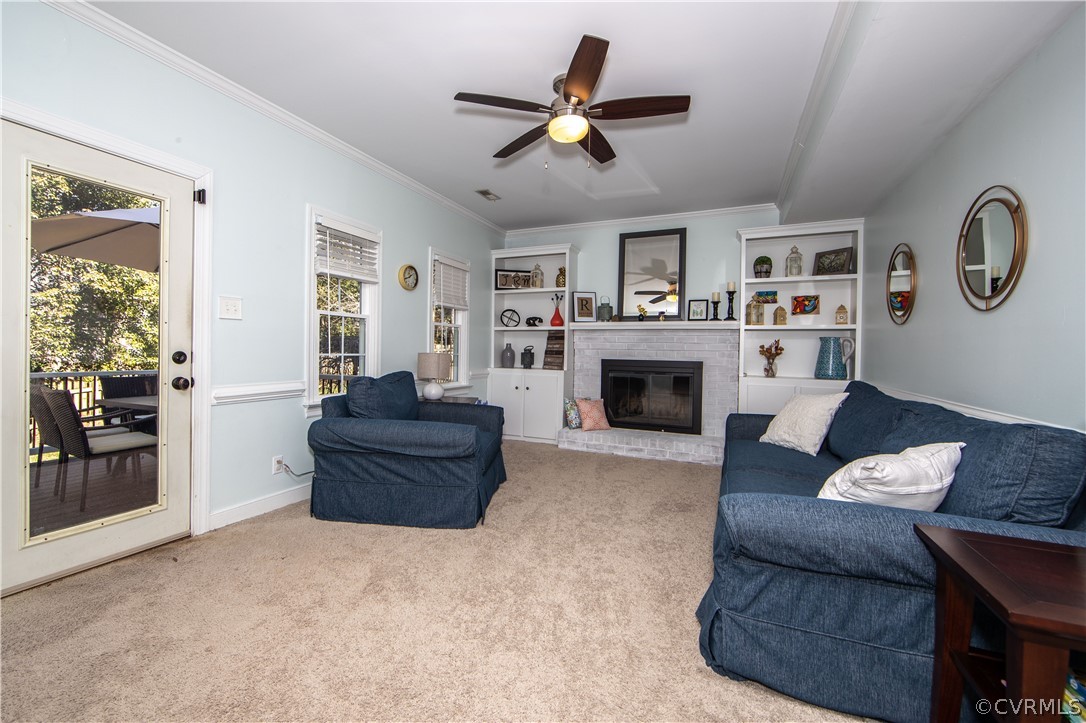 6212 Lansgate Road Midlothian, VA 23112 - Photo 4 of 26 a living room with furniture and a fireplace