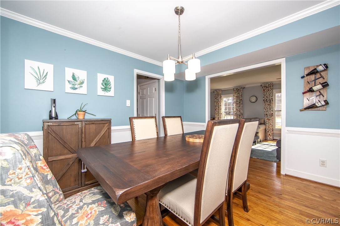 6212 Lansgate Road Midlothian, VA 23112 - Photo 9 of 26 a view of a dining room with furniture and wooden floor