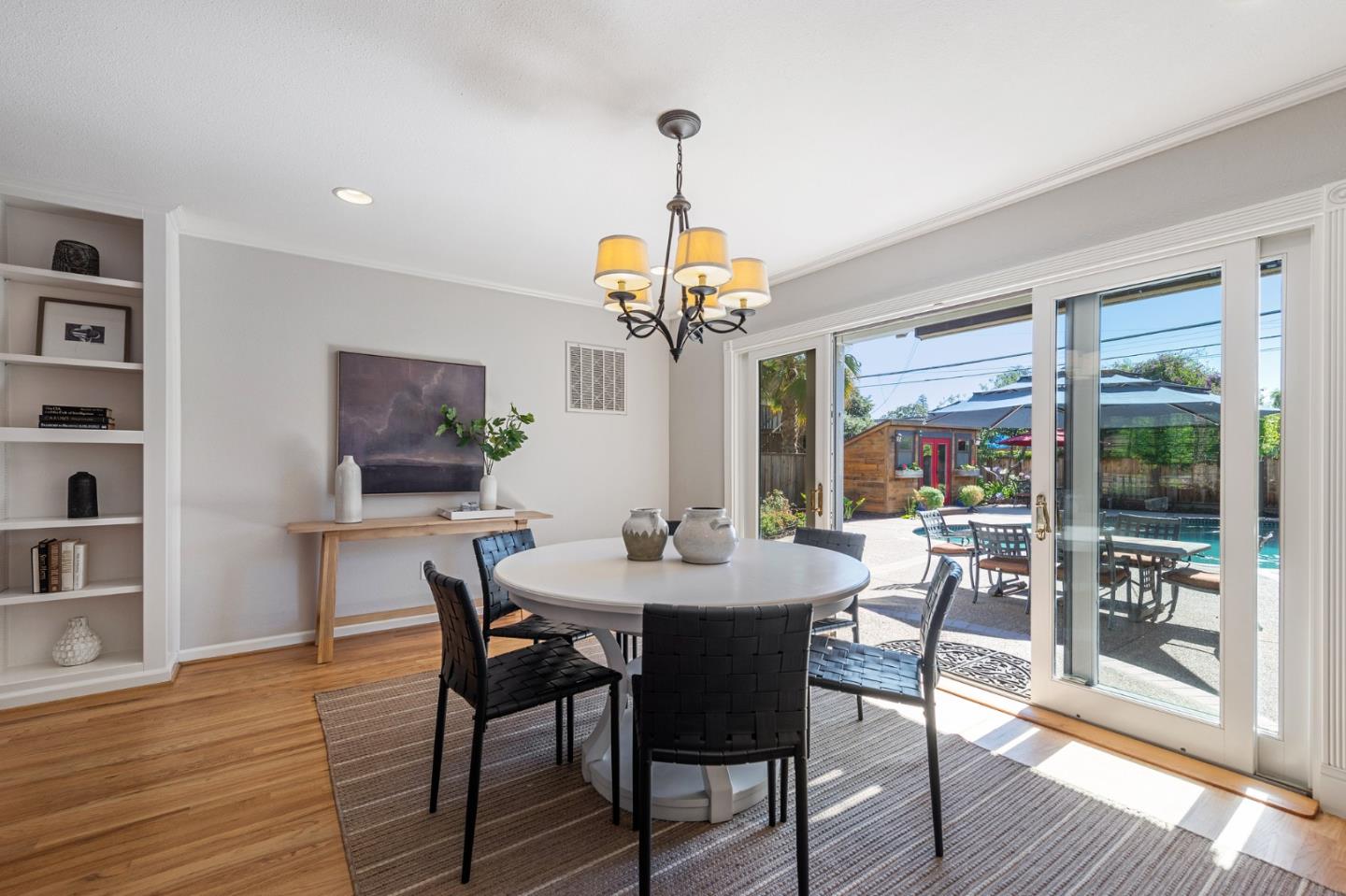 851 Almarida Drive Campbell, CA 95008 - Photo 13 of 63 a dining room with wooden floor a chandelier a wooden table and chairs