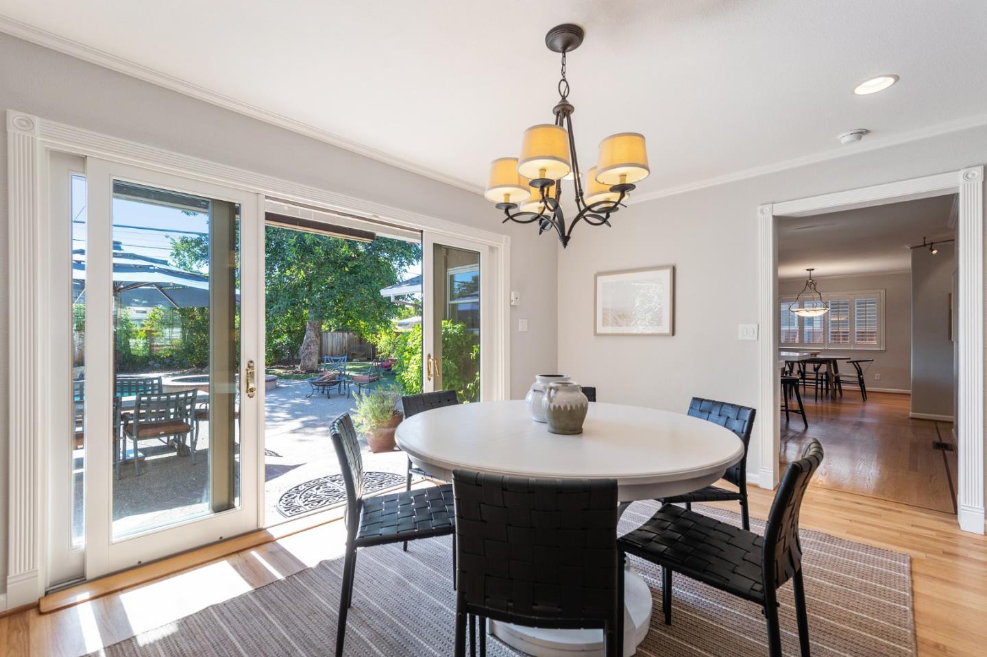 851 Almarida Drive Campbell, CA 95008 - Photo 14 of 63 a view of a dining room with furniture wooden floor and chandelier