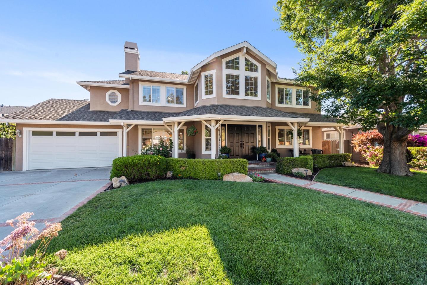 851 Almarida Drive Campbell, CA 95008 - Photo 2 of 63 a front view of a house with a yard and garage