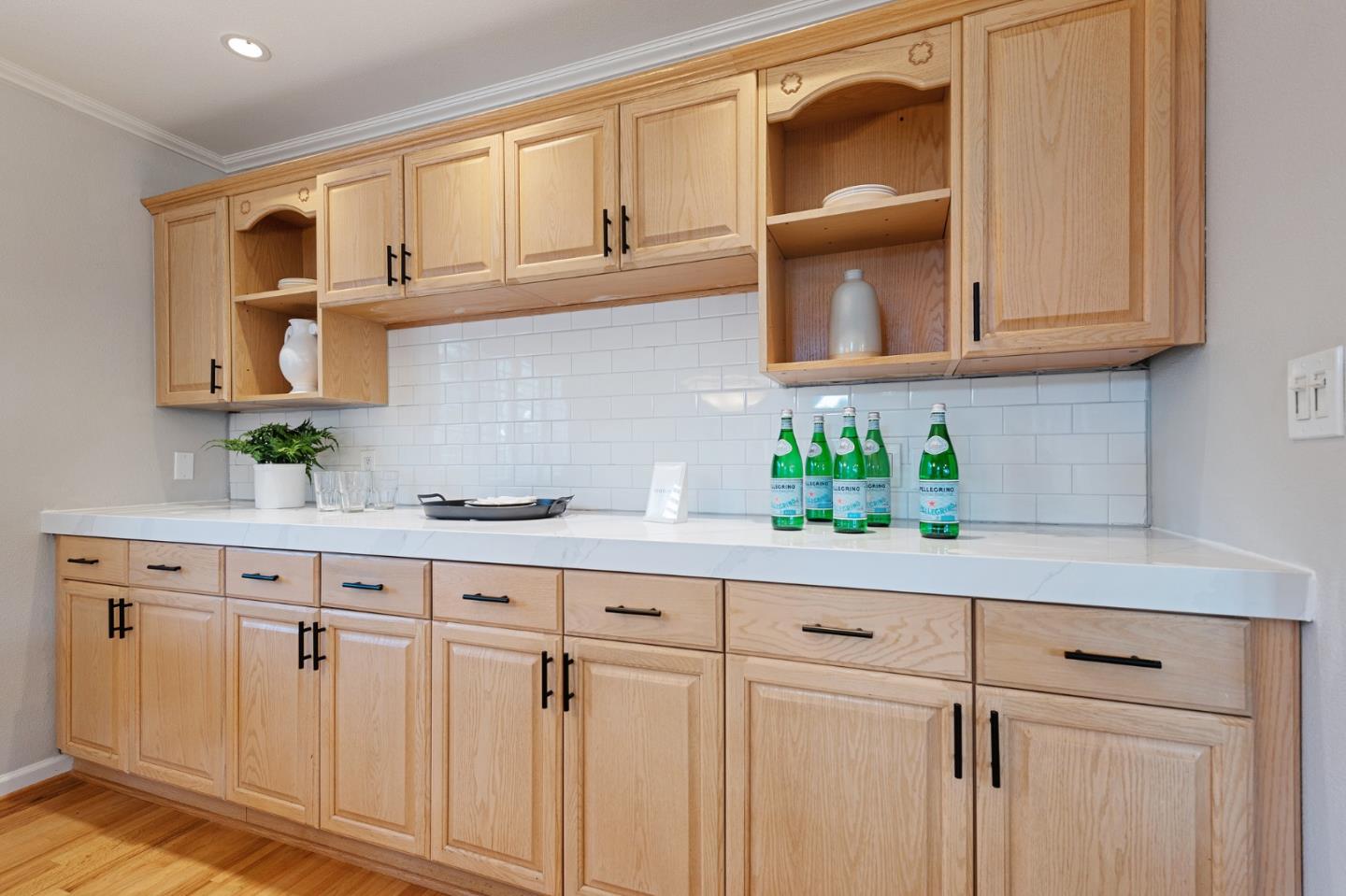 851 Almarida Drive Campbell, CA 95008 - Photo 24 of 63 a kitchen with white cabinets and a potted plant