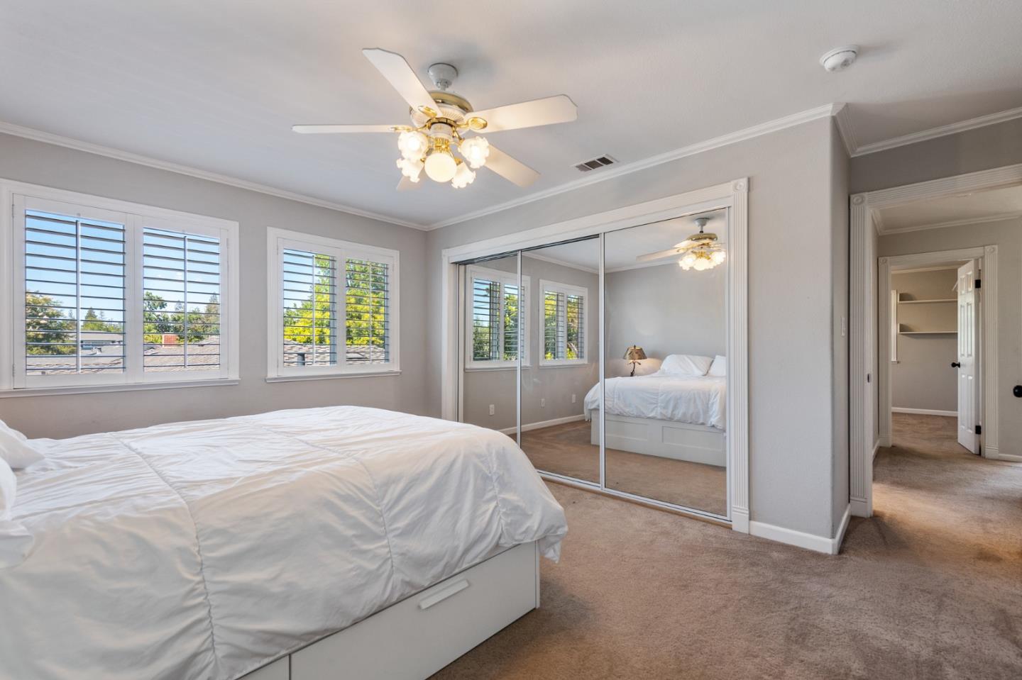 851 Almarida Drive Campbell, CA 95008 - Photo 47 of 63 a spacious bedroom with a large bed and a chandelier