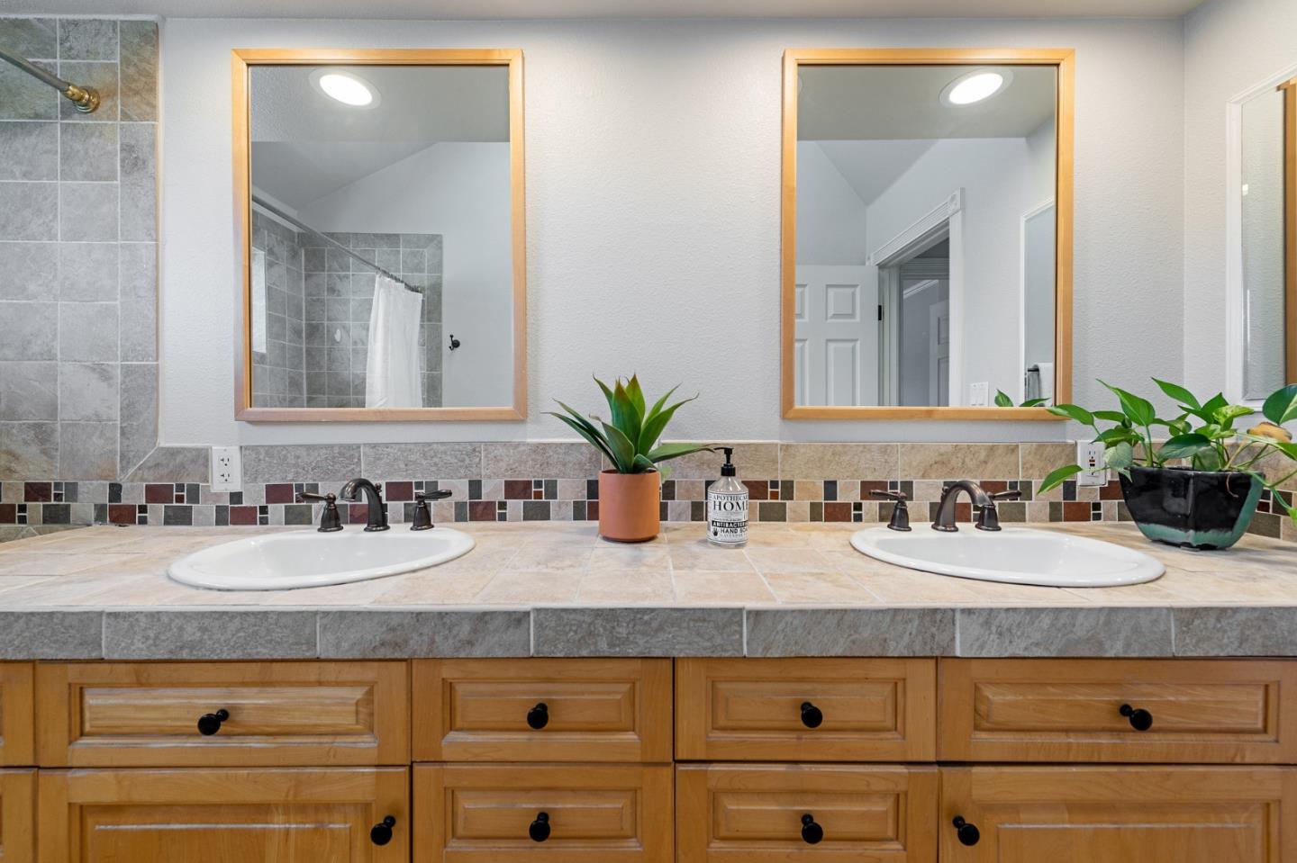 851 Almarida Drive Campbell, CA 95008 - Photo 48 of 63 a bathroom with a sink and a mirror