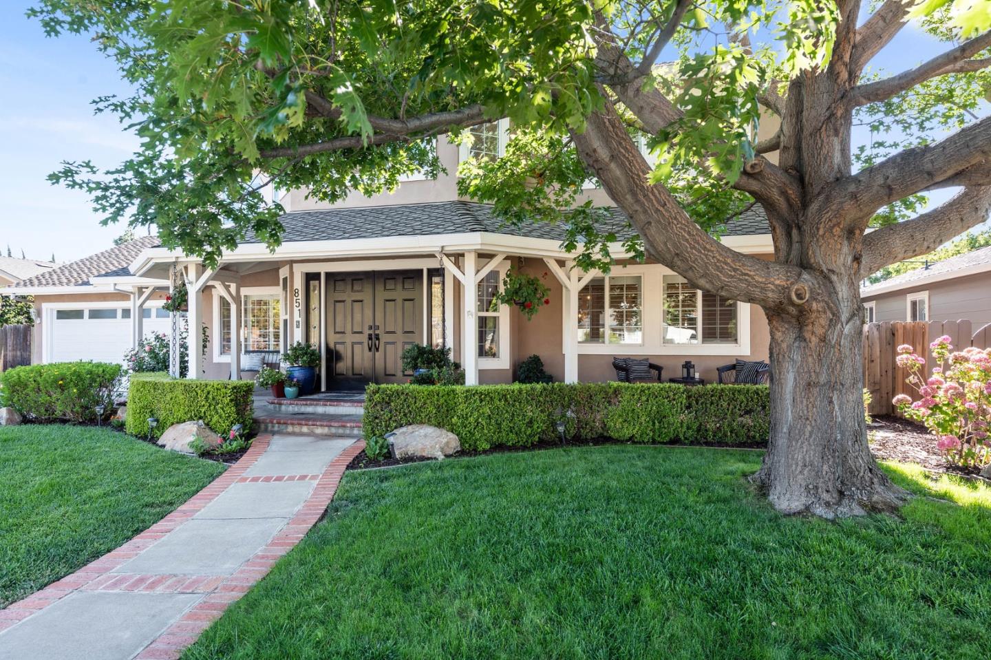 851 Almarida Drive Campbell, CA 95008 - Photo 60 of 63 a front view of a house with a yard and potted plants