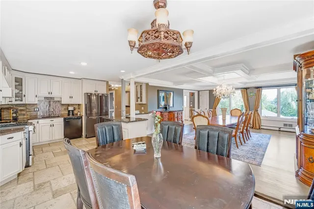 a living room with lots of furniture and a chandelier