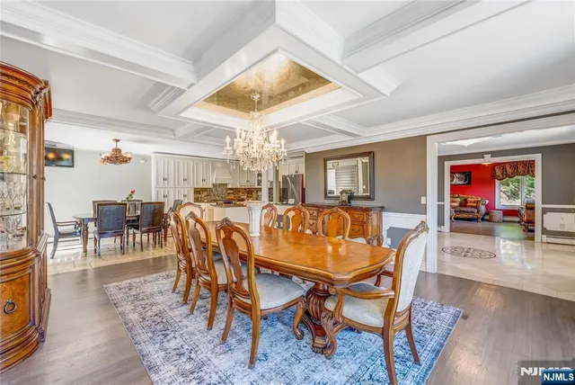 a dining room with furniture and wooden floor