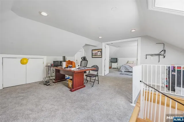 a view of a workspace with furniture and toys