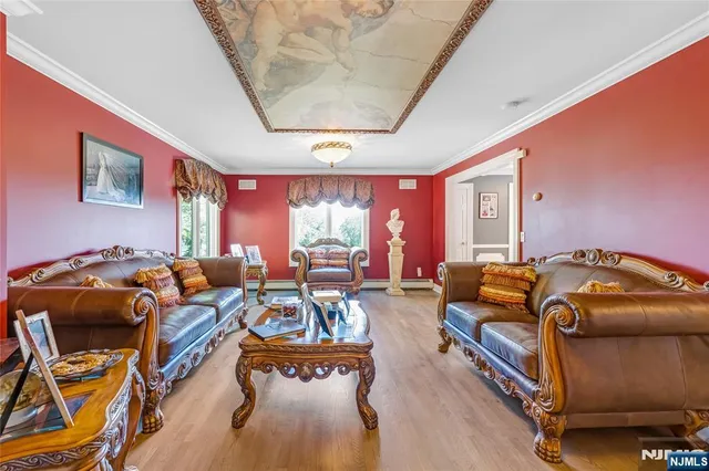 a living room with furniture a rug and a large window