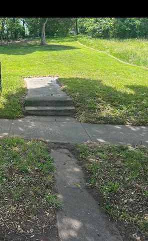 a view of a yard with an outdoor space