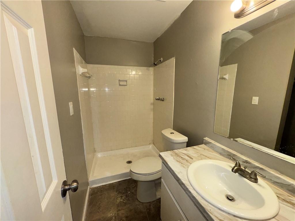 3575 Oakvale Road, Unit 911 Decatur, GA 30034 - Photo 10 of 10 a bathroom with a sink a toilet and shower