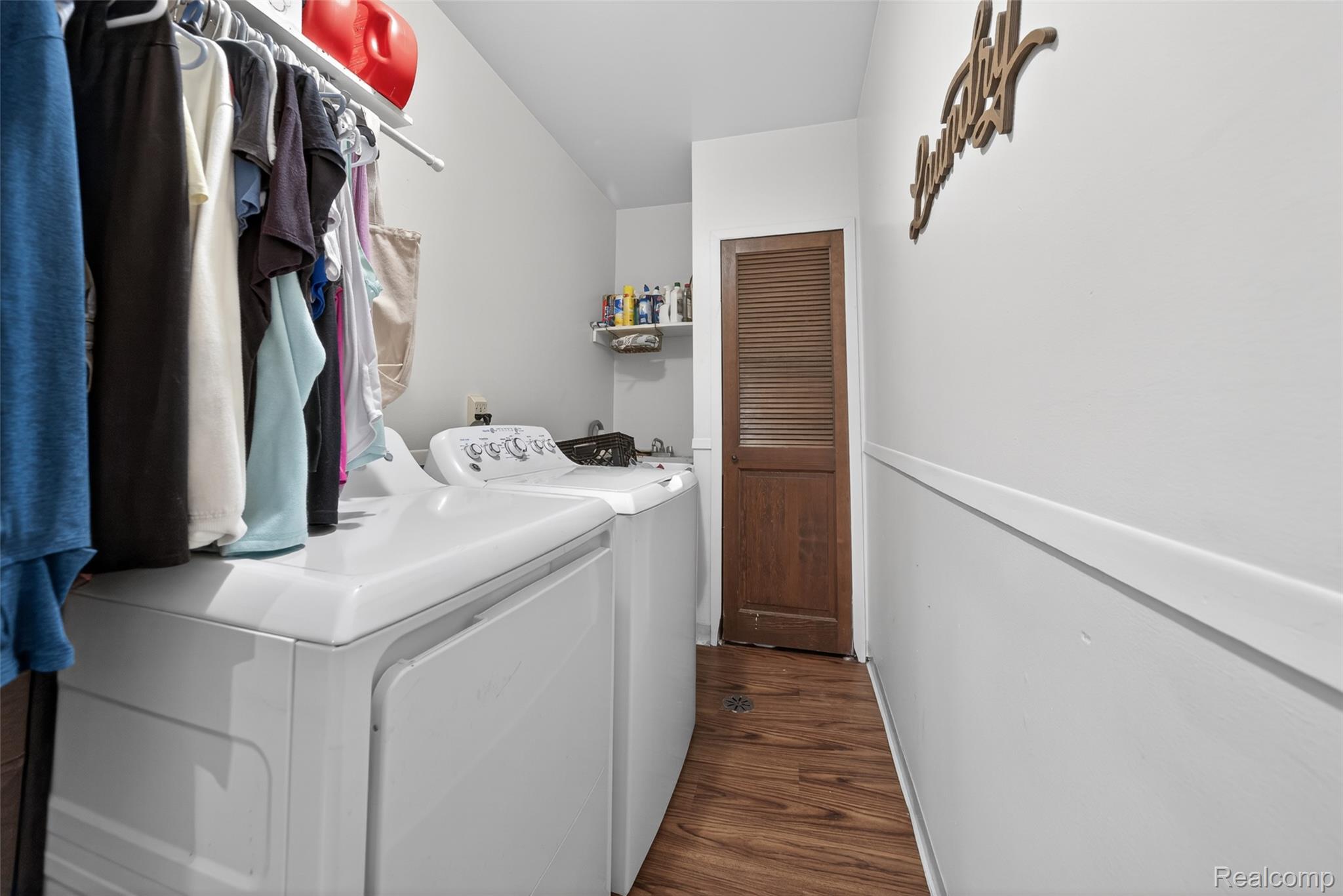 2578 Powderhorn Ridge Road Rochester, MI 48309 - Photo 26 of 46 Laundry room featuring dark wood-type flooring and washer and clothes dryer