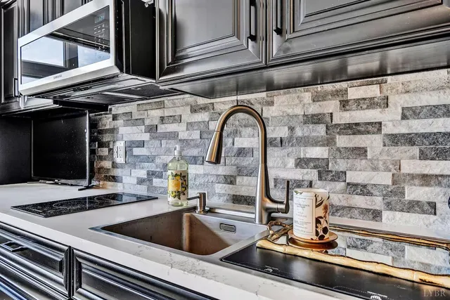 a bathroom with a granite countertop sink vanity and a mirror