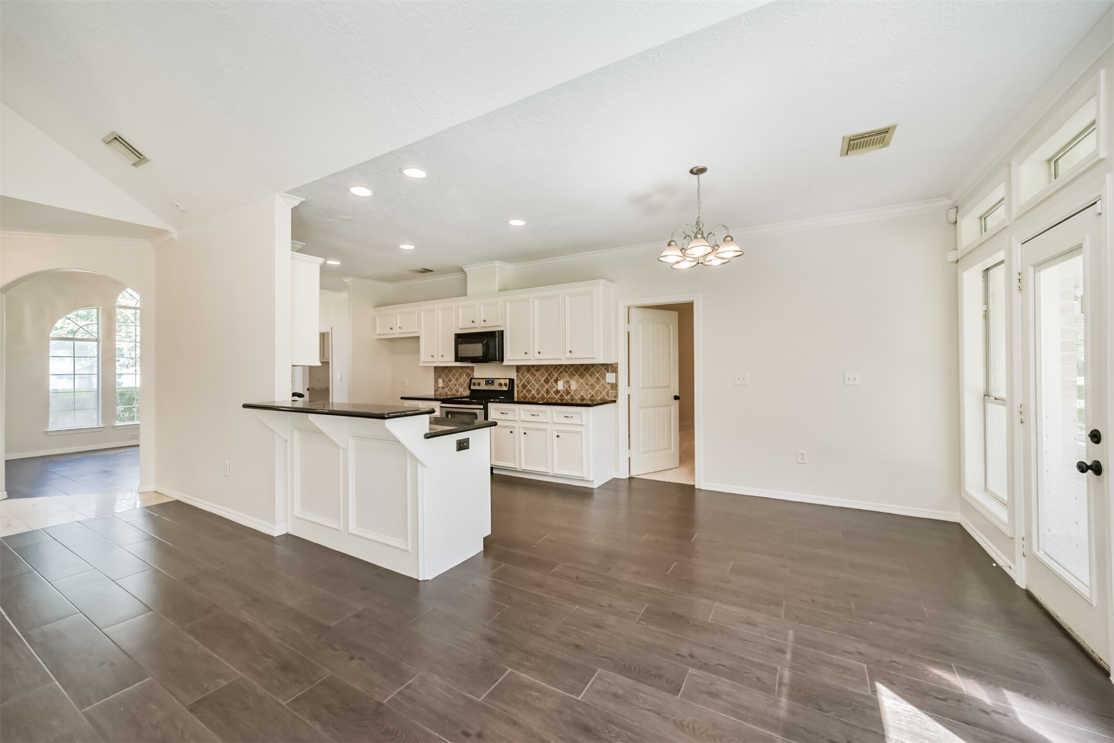27322 Afton Way Huffman, TX 77336 - Photo 15 of 50 Generous dining area flows effortlessly into the kitchen and living spaces with views of the covered patio and backyard.