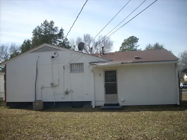 a view of a house with a small yard