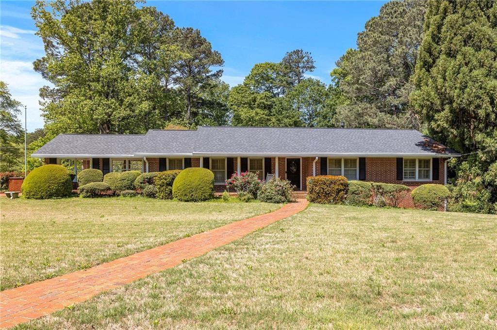 670 North Superior Avenue Decatur, GA 30033 - Photo 1 of 1 a front view of a house with a yard