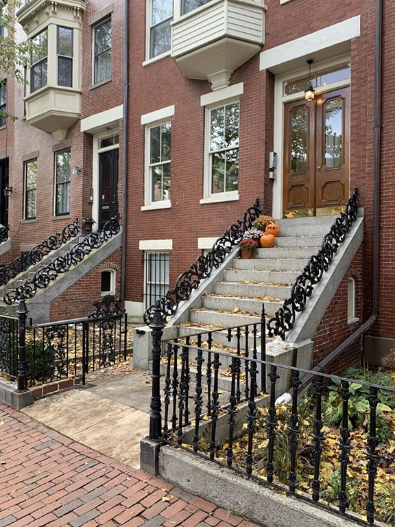 a view of a patio with couches table and chairs