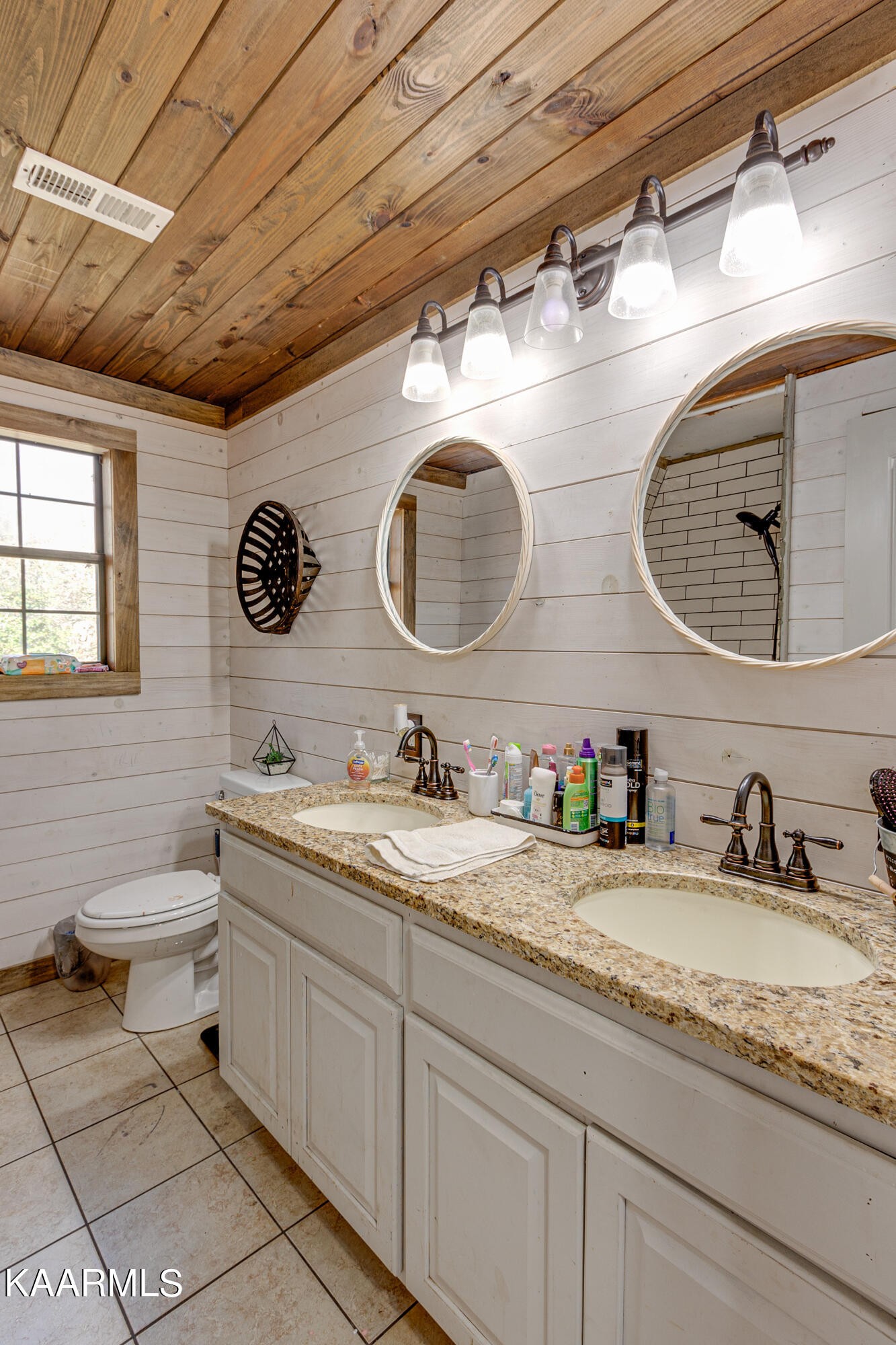 905 Williamsburg Road Winfield, TN 37892 - Photo 18 of 35 a bathroom with a granite countertop toilet sink and mirror