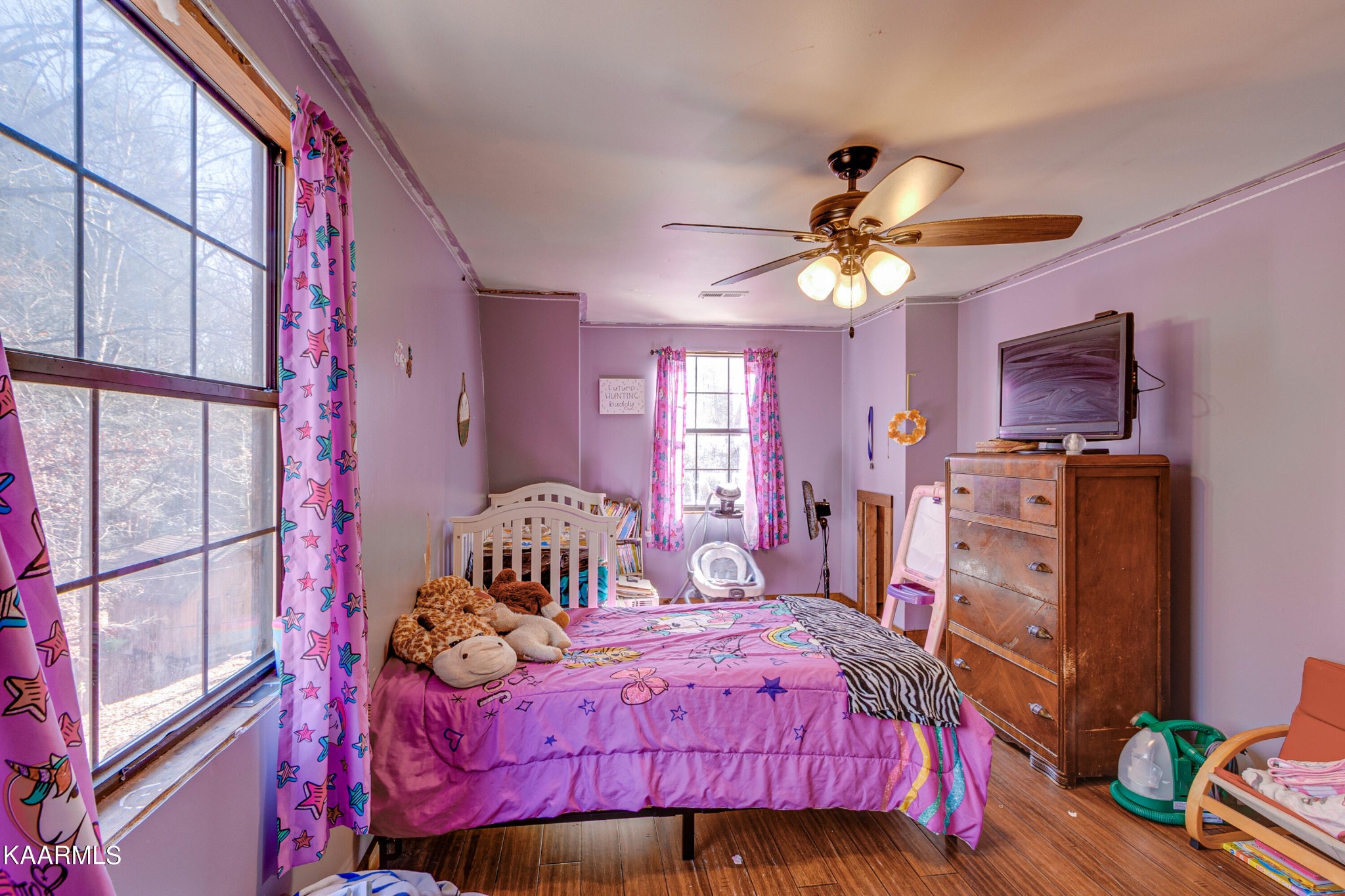 905 Williamsburg Road Winfield, TN 37892 - Photo 20 of 35 a bedroom with a bed and a chandelier