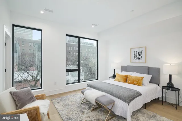 a bedroom with a bed and a couch