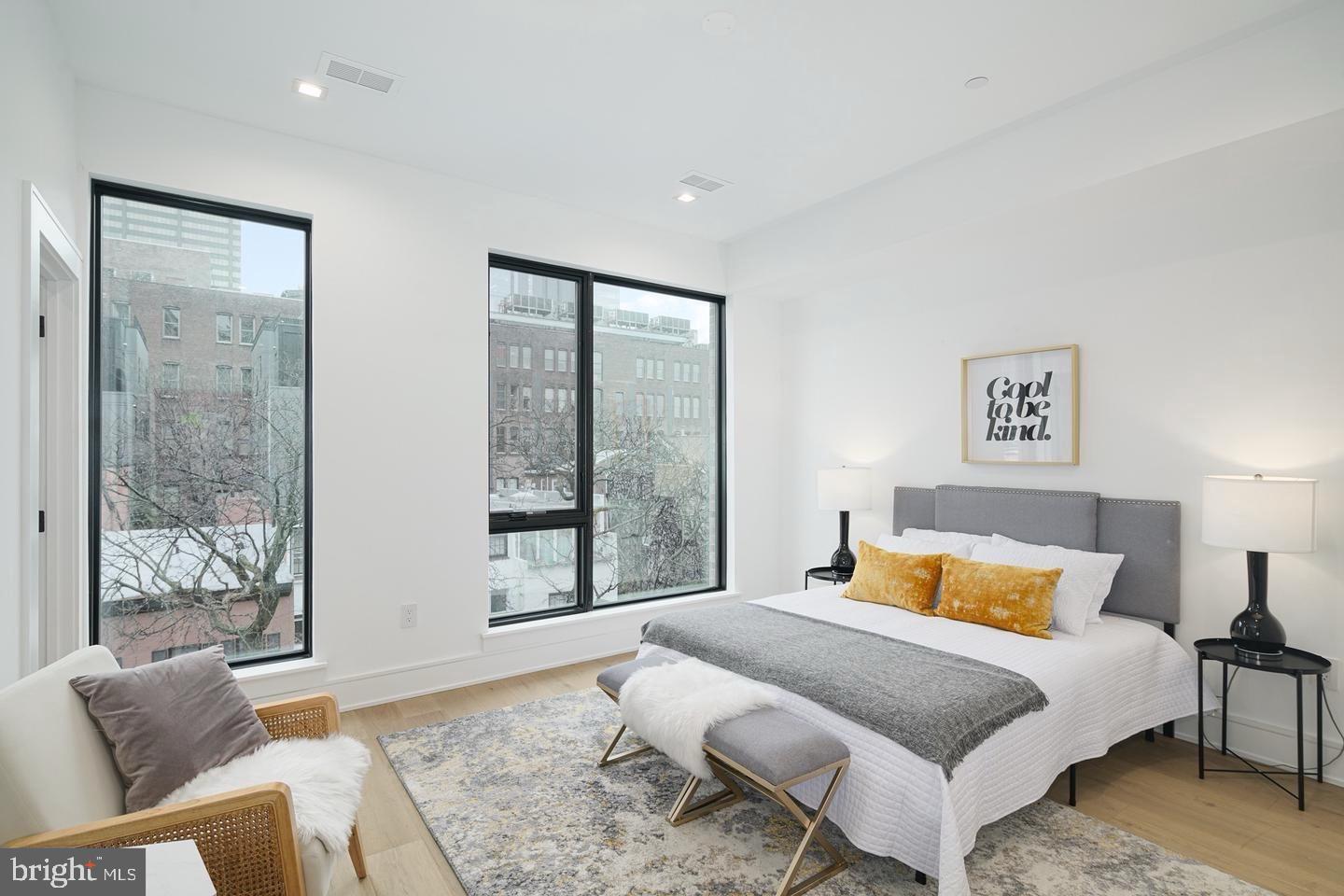 2316 Sansom Street Philadelphia, PA 19103 - Photo 23 of 55 a bedroom with a bed and glass window