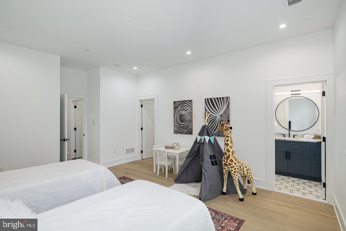 2316 Sansom Street Philadelphia, PA 19103 - Photo 29 of 55 a bedroom with two beds and a lamp