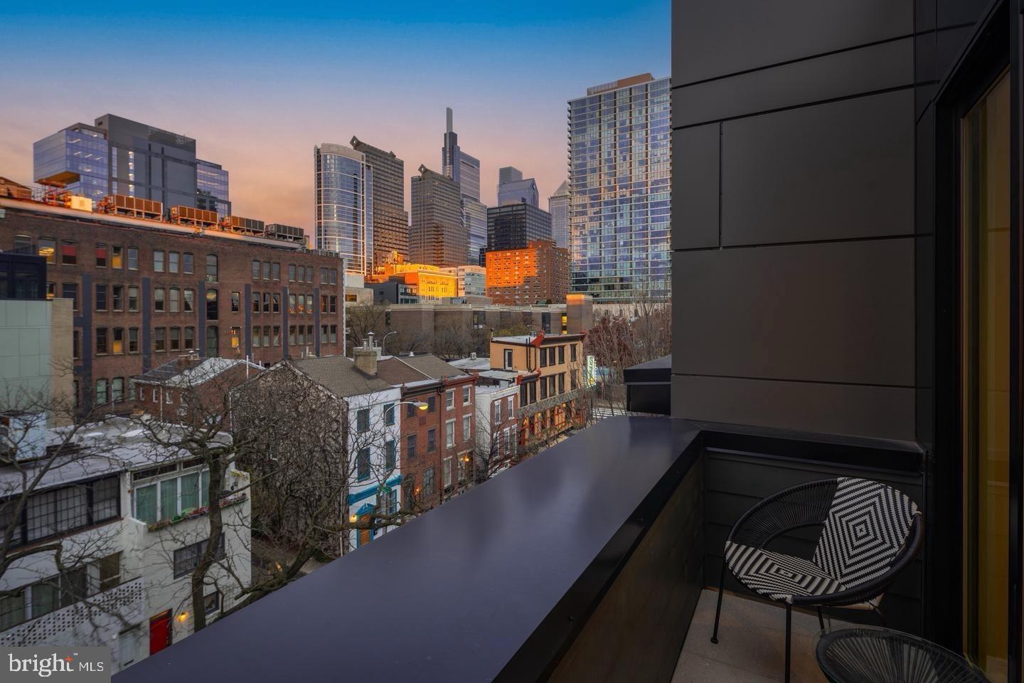 2316 Sansom Street Philadelphia, PA 19103 - Photo 32 of 55 Urban skyline at sunset from a chic balcony.