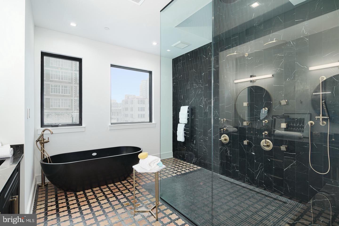 2316 Sansom Street Philadelphia, PA 19103 - Photo 37 of 55 a bathroom with a granite countertop sink a toilet and mirror