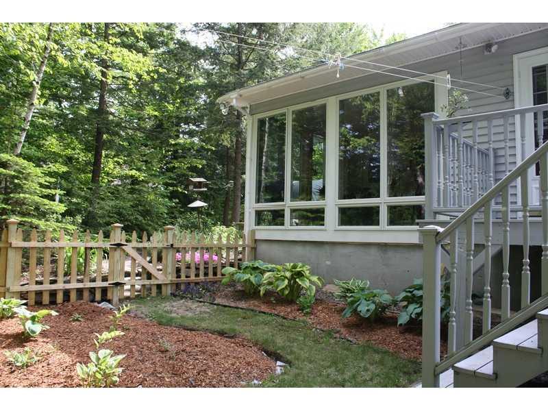 152 Peninsula Drive Rome, ME 04963 - Photo 2 of 29 Exterior Back. Sunroom & section of...