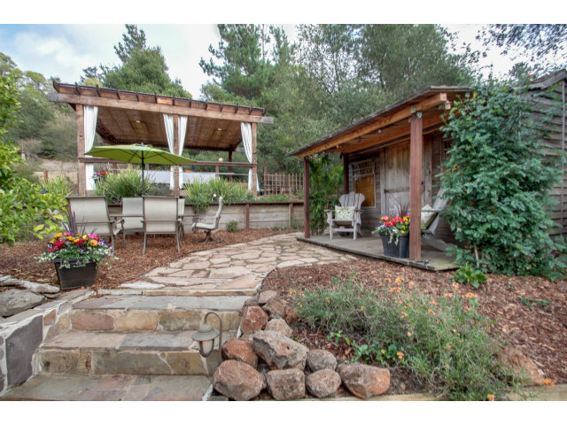 2791 Valencia Road Aptos, CA 95003 - Photo 18 of 21 a view of backyard with seating space and trees in the background