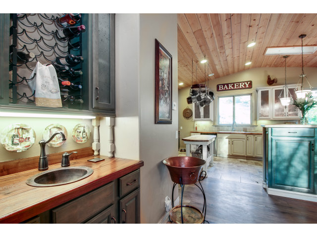 2791 Valencia Road Aptos, CA 95003 - Photo 3 of 21 a kitchen with stainless steel appliances kitchen island granite countertop a sink and a refrigerator