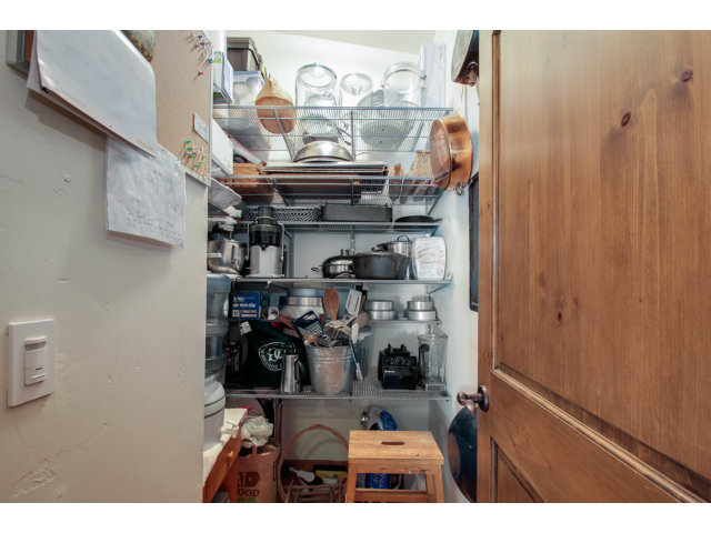 2791 Valencia Road Aptos, CA 95003 - Photo 6 of 21 a kitchen with a refrigerator and cabinets