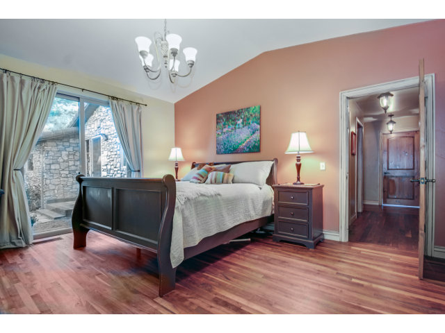 2791 Valencia Road Aptos, CA 95003 - Photo 10 of 21 a bedroom with a bed and wooden floor