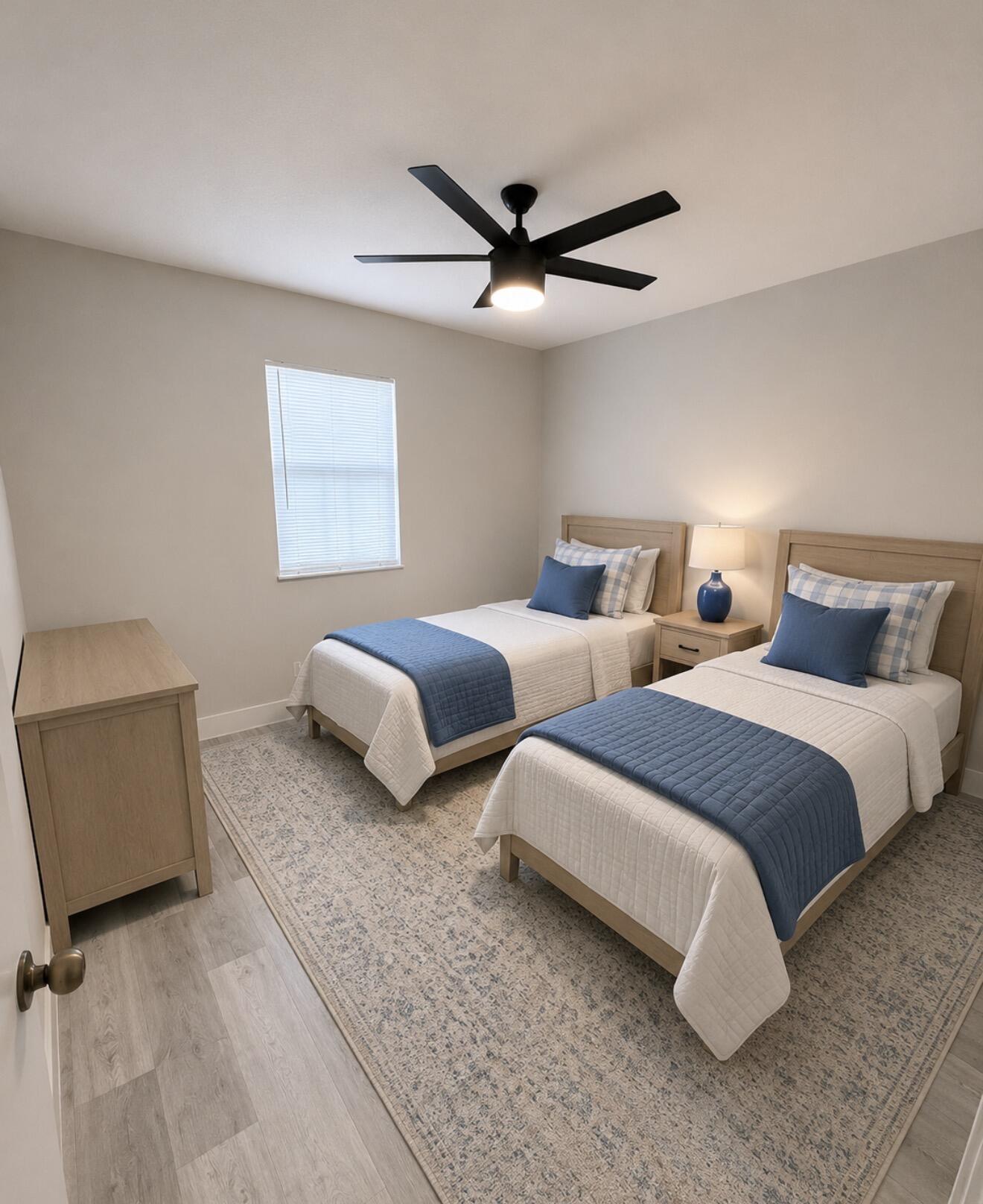 22324 Southwest 57th Circle Boca Raton, FL 33428 - Photo 9 of 22 a bedroom with two beds and painting on the wall