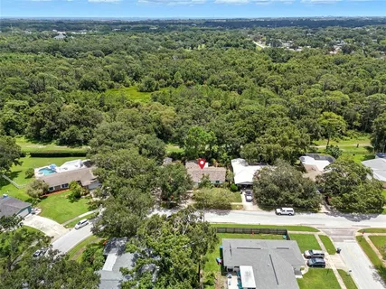 an aerial view of a house with a yard