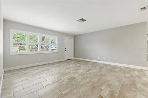 a view of an empty room with a window