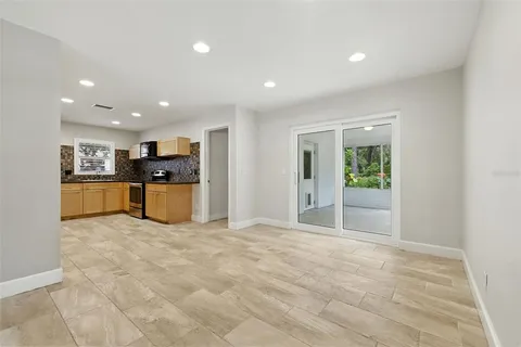 a view of a kitchen with a sink and a refrigerator