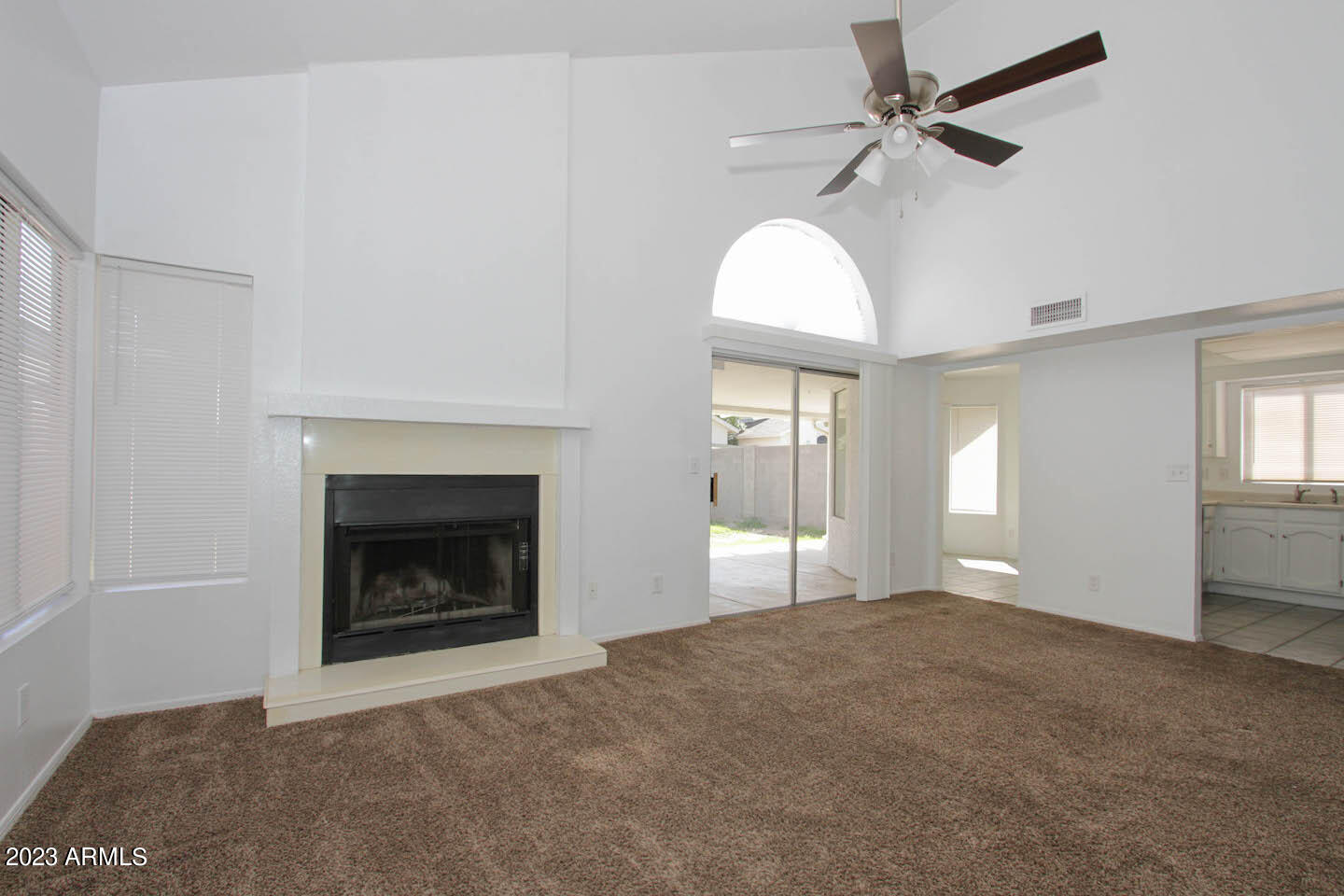 4401 West Tonto Road Glendale, AZ 85308 - Photo 11 of 29 a view of an empty room with window and fireplace